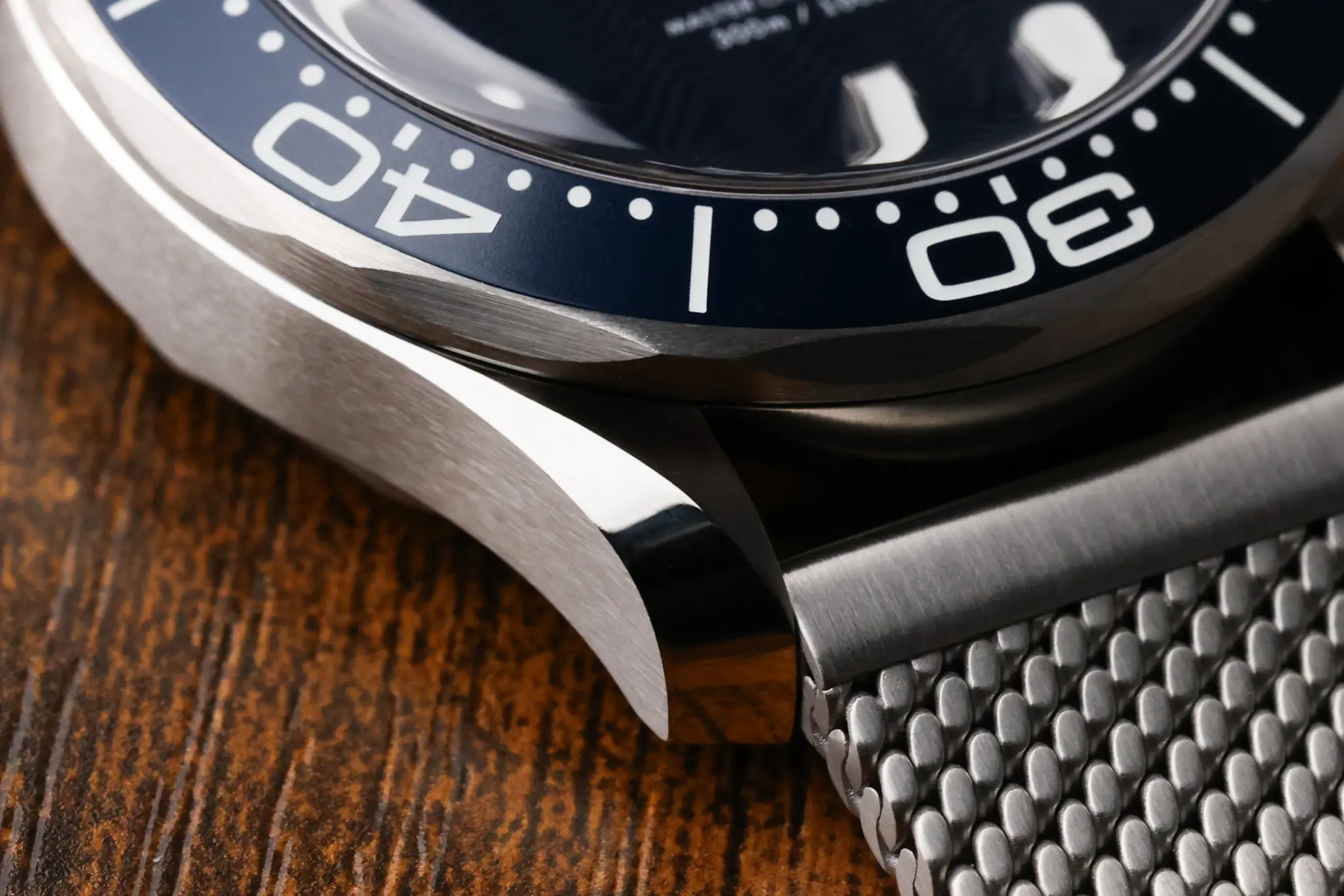 Omega Seamaster Diver 300M case and bezel detail on mesh bracelet