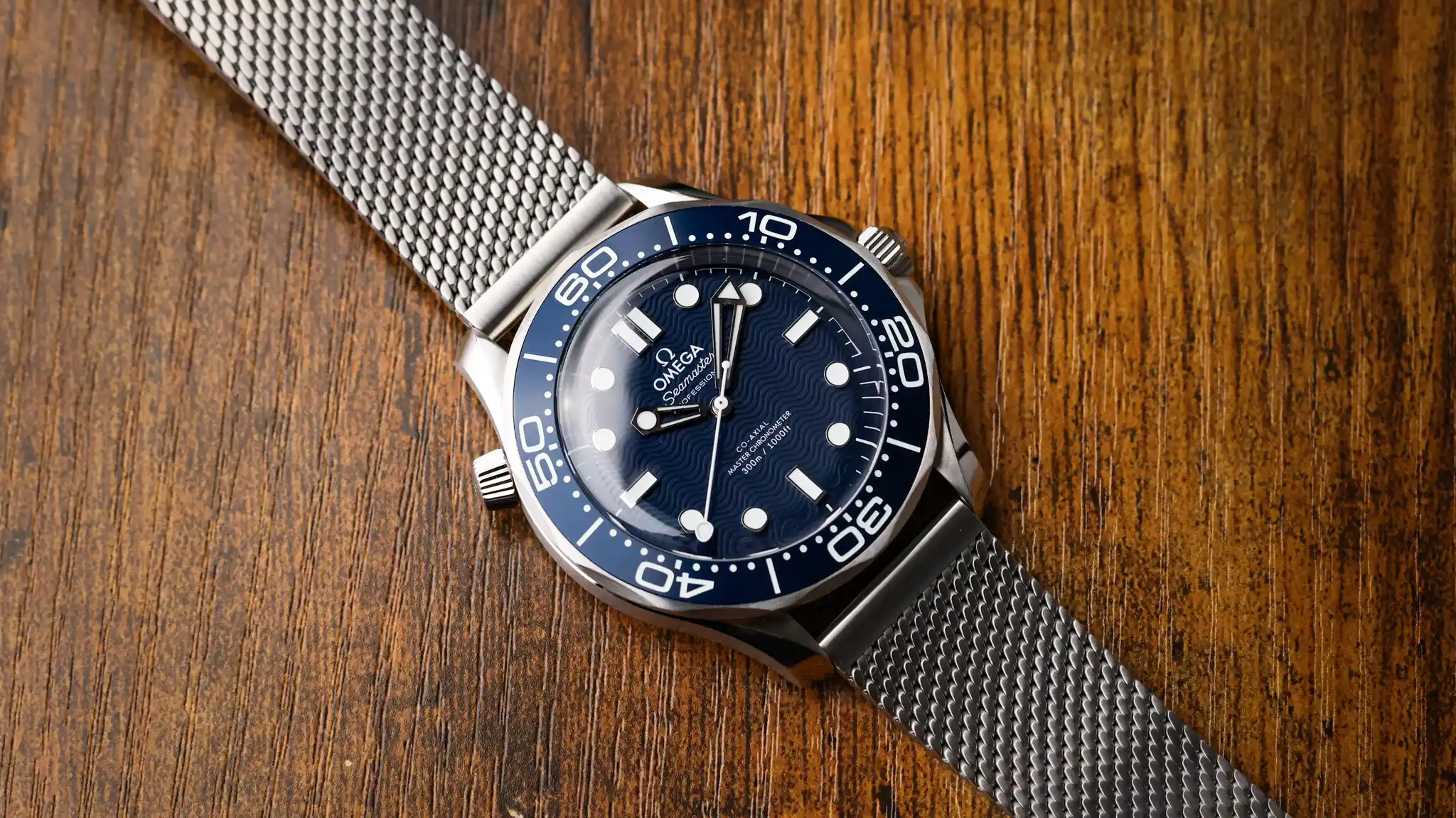 Omega Seamaster James Bond 60th Anniversary worn on mesh bracelet with blue dial