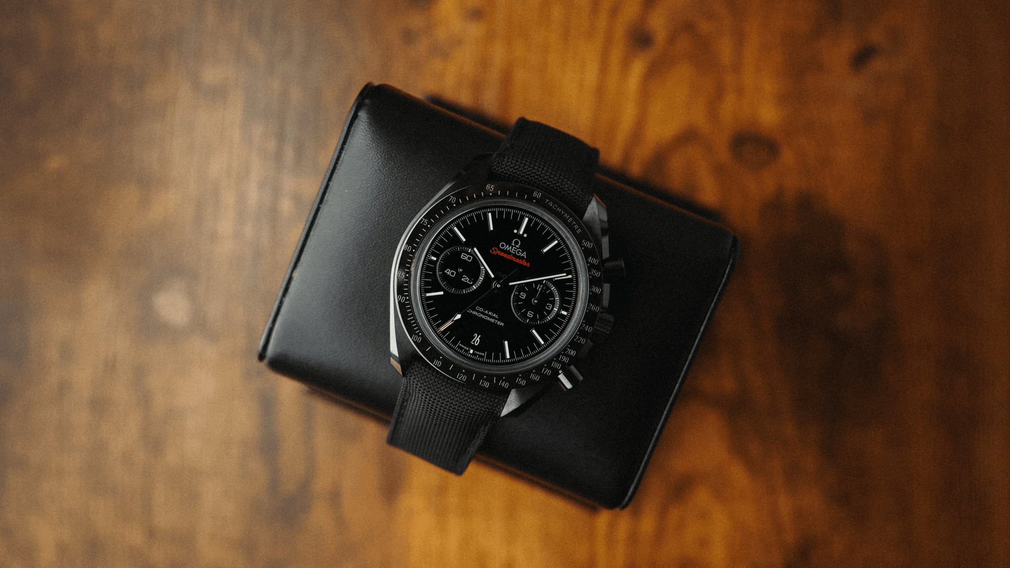 Omega Speedmaster Dark Side of the Moon ceramic chronograph watch on black nylon strap