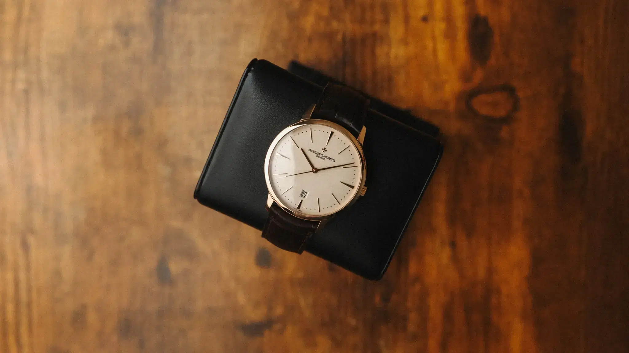 Vacheron Constantin Patrimony 40mm rose gold watch on brown alligator strap, top-down lifestyle view